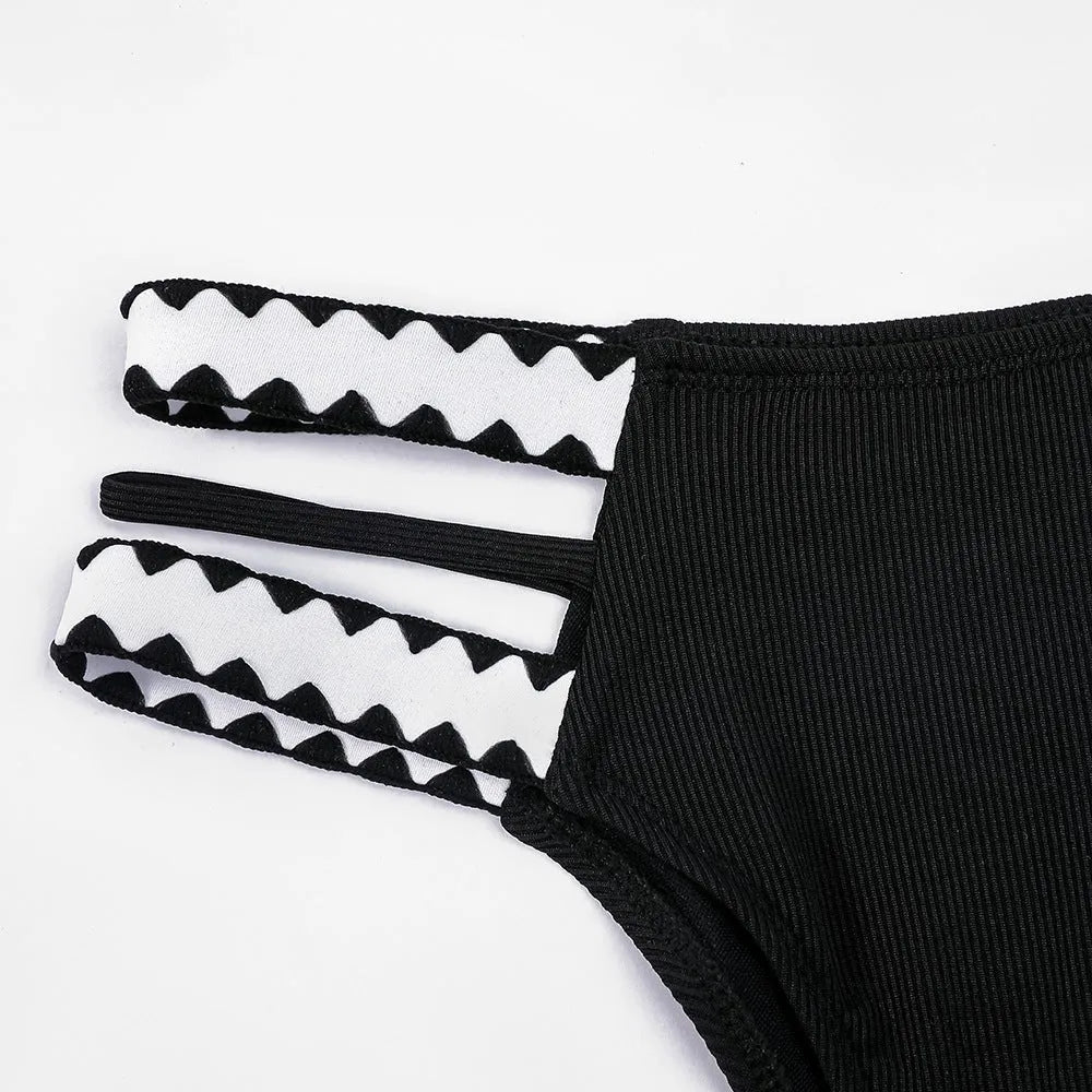 Black women's bikini swimsuit with a hollowed-out split design, showing front and back views.