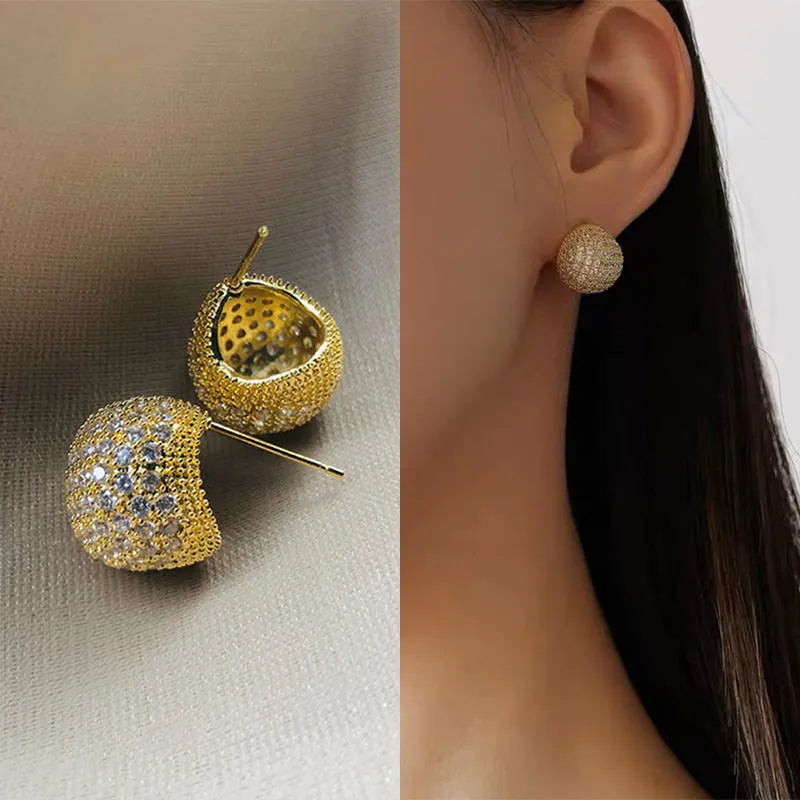 Golden beans shaped clip earrings with diamond crystals in drop geometric design