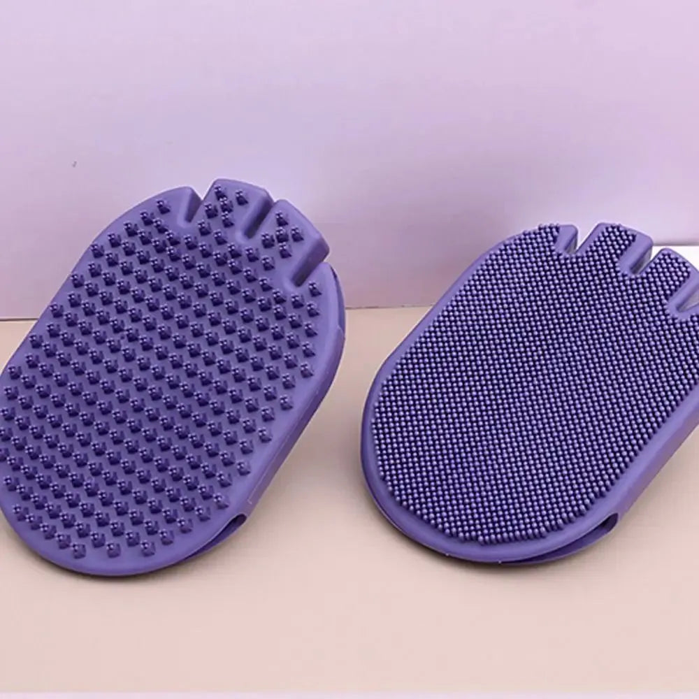 Purple dual-sided pet shampoo massage brush with soft TPR bristles and ergonomic handle.