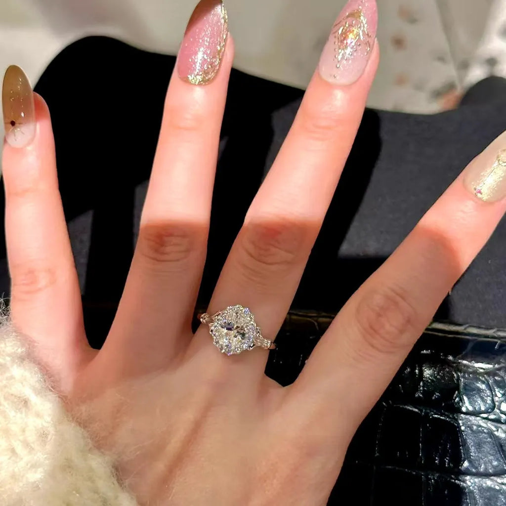 Silver adjustable ring with a large geometric bridal bouquet design and diamond treatment.