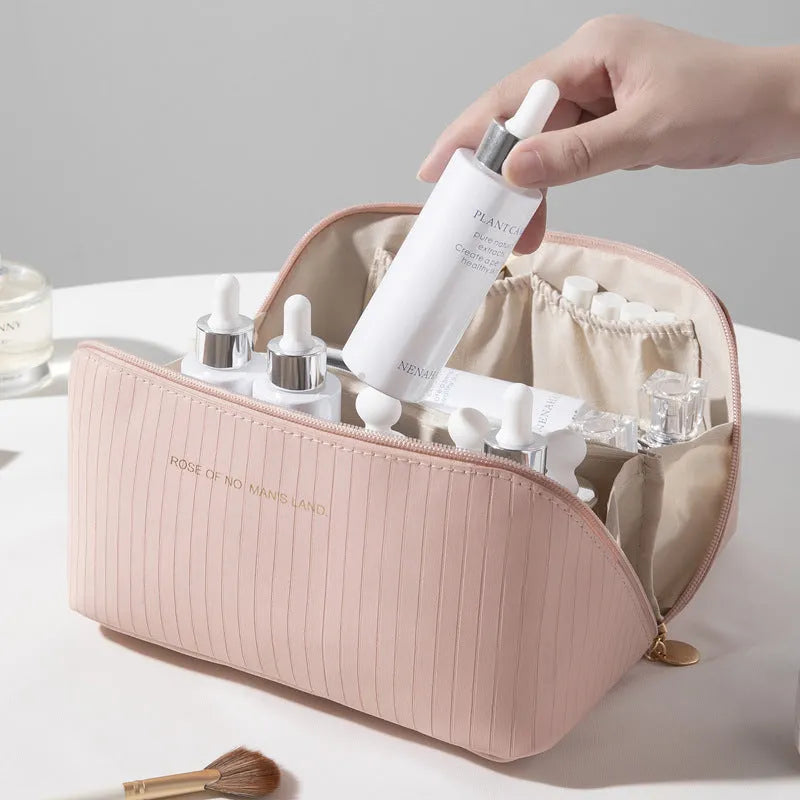 Vertical stripe pattern cubic makeup bag in PU material measuring 22.5cm wide