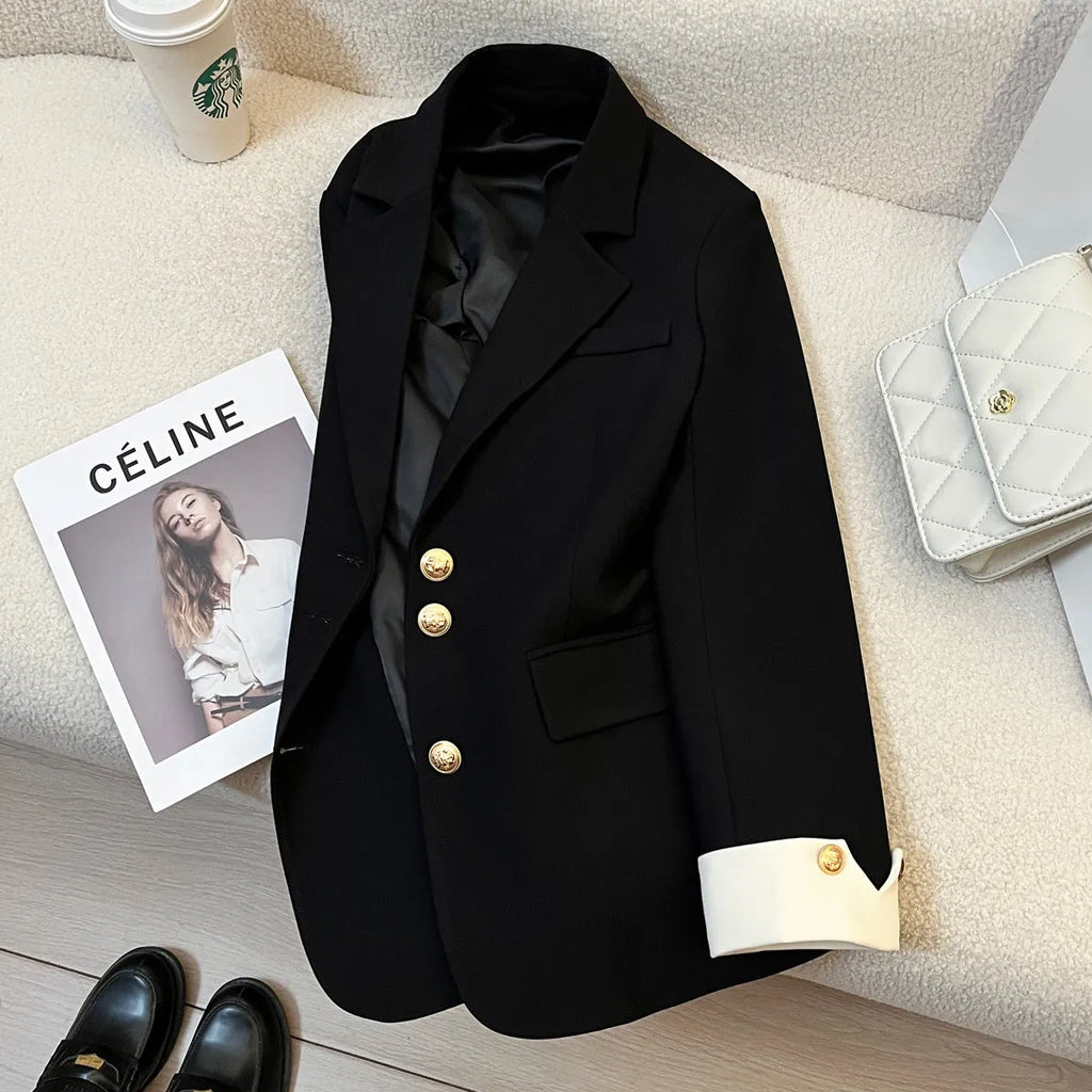 Korean style loose fit women's coat in milky white, showing long sleeves and pockets.