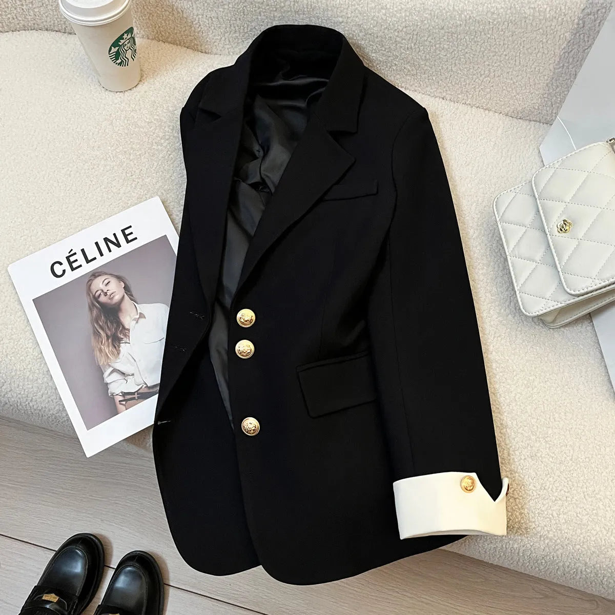 Korean style loose fit women's coat in milky white, showing long sleeves and pockets.