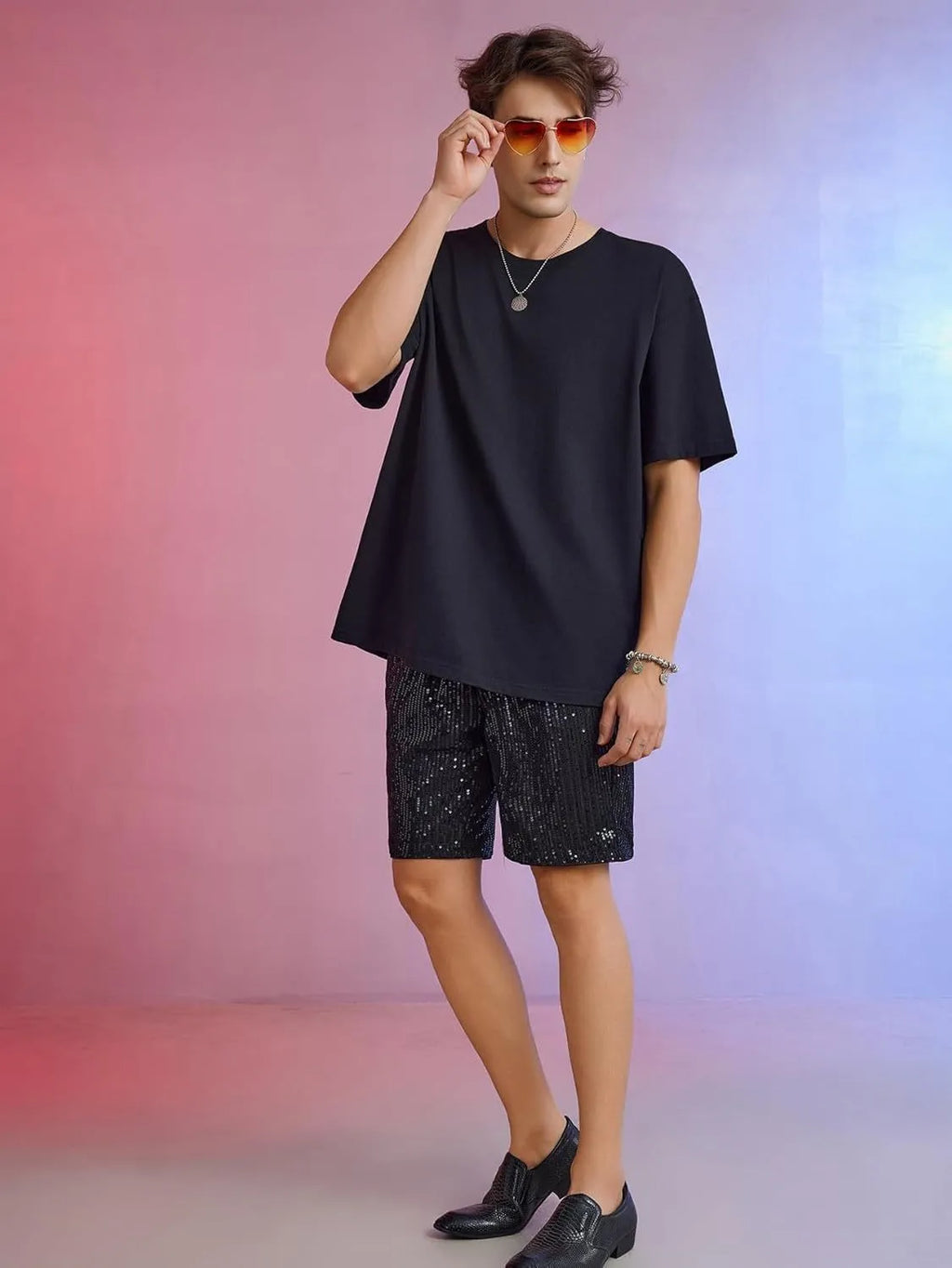 Men's silver sequin straight cut shorts with elastic waistband on mannequin display