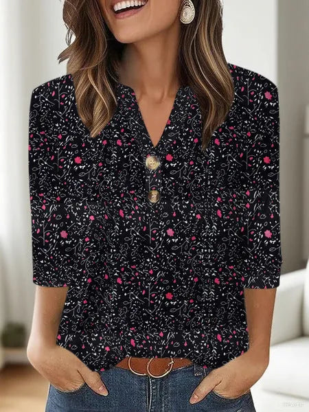 Loose fit women's V-neck T-shirt with a colourful 3D printed pattern on the front.
