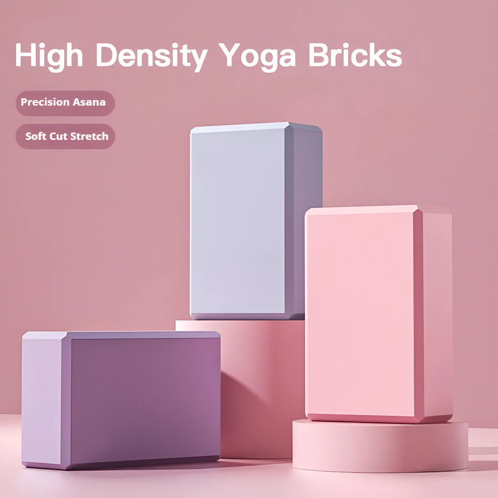 Solid colour EVA foam yoga block measuring 23cm long on a workout mat.