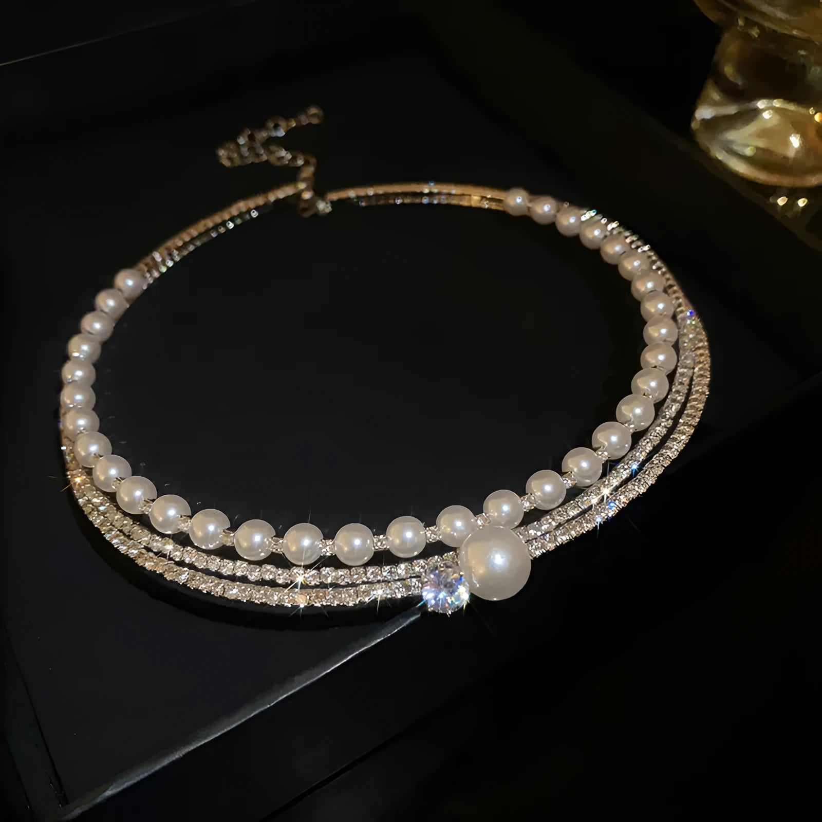 Silver geometric round pendant necklace with an exaggerated curve, on a clavicle-length alloy chain.