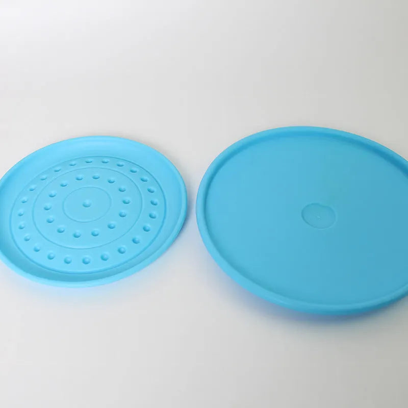 Rubber dog flying disc toy in multiple colours showing small and large size variants for canine fetch games