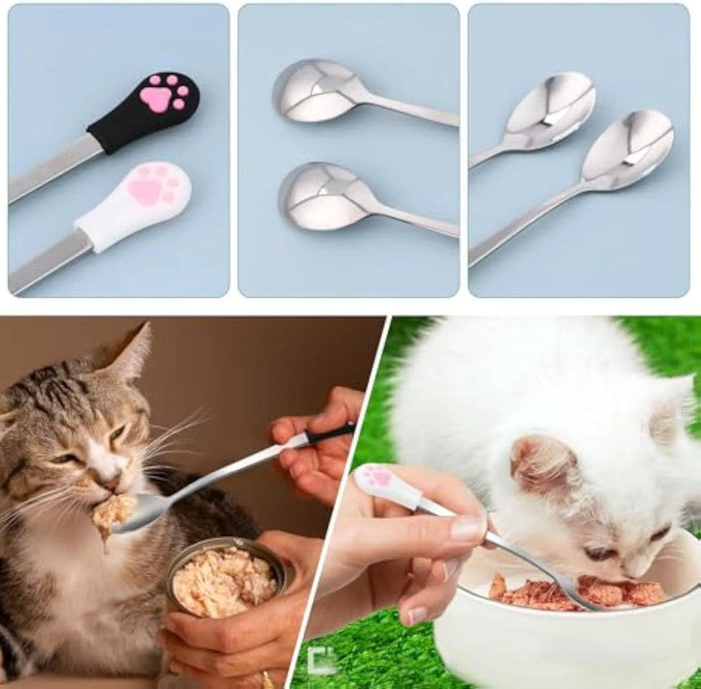White and black stainless steel pet food spoons with cat paw print and silicone handle grips.