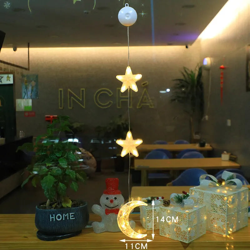 Set of three battery-powered LED Christmas pendant lights with suction cups, showing star, tree, and deer designs.