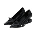 Black women's pointed toe Mary Jane high heels with a distinctive shaped floating heel on a white background.