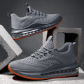 Men's black mesh running shoes with round toe and lace-up front, showing cushion damping sole