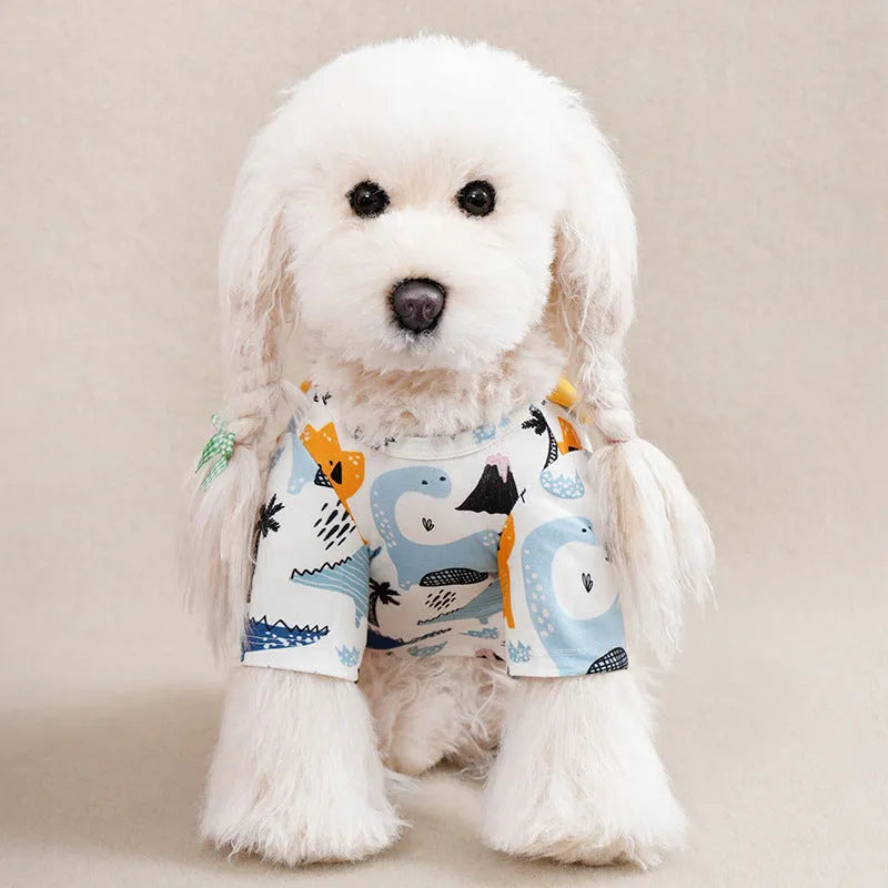 Colourful printed dog t-shirt on a small dog, showing the casual fit and full graphic design.