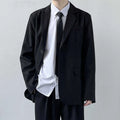 Plus size men's grey suit jacket and trousers set with white shirt and blue tie on a hanger