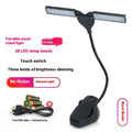 Black rechargeable music stand lamp with 28 LEDs on a metal music stand.