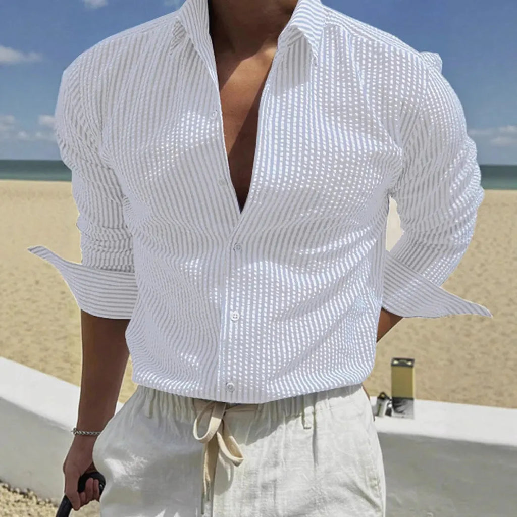 Man's blue and white striped button-up shirt with a lapel collar and long sleeves.
