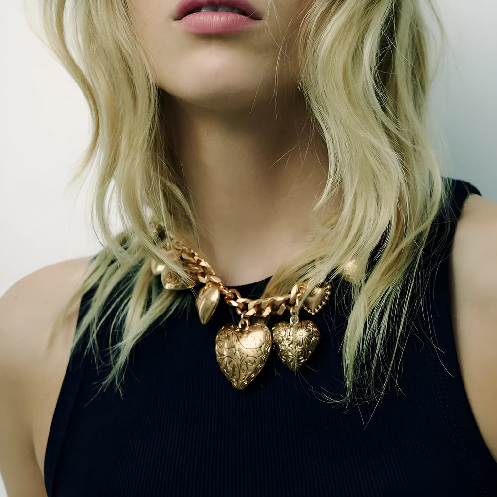 Exaggerated carved heart pendant necklace on metal chain with adjustable 41-50cm length in gold finish