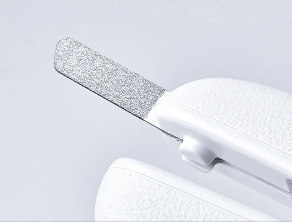 White pet nail clipper with LED light, transparent anti-splash guard, and leather-like handle
