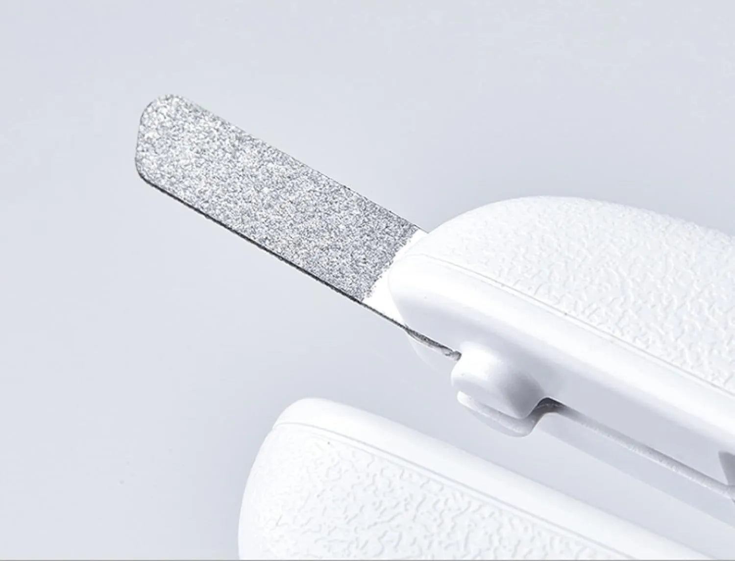 White pet nail clipper with LED light, transparent anti-splash guard, and leather-like handle
