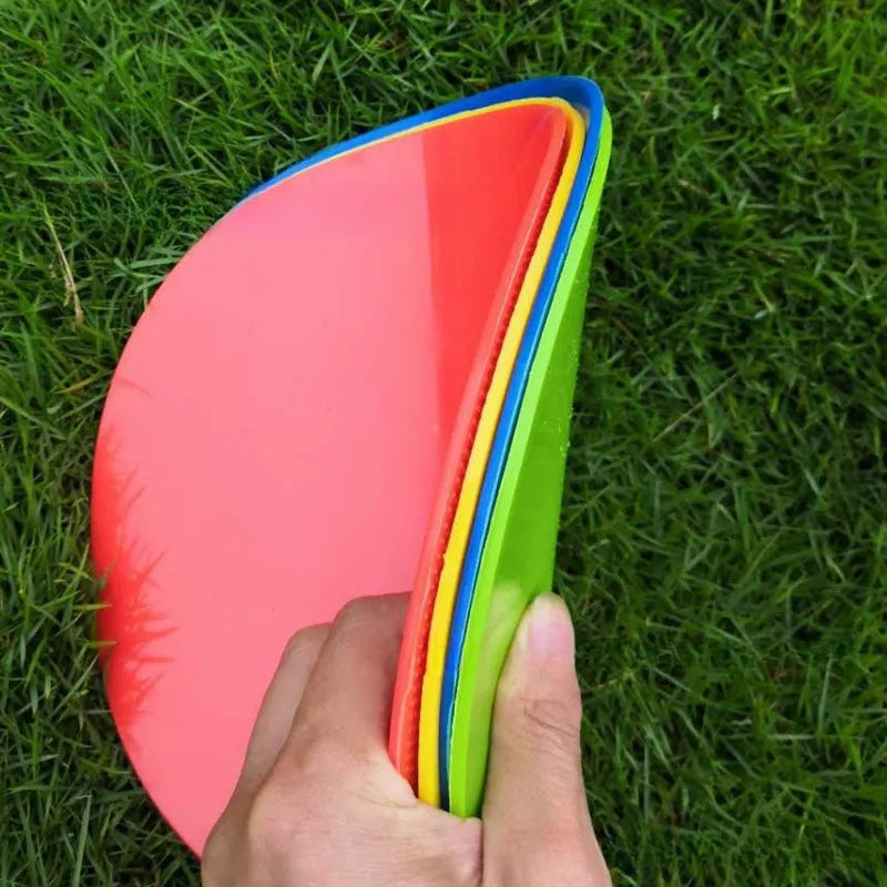 Yellow TPE football landmark pad disc on grass, 23cm diameter flat sports training marker.