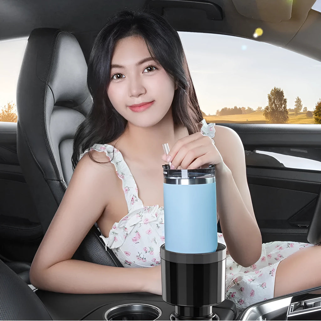 Matte black car cup holder expander with adjustable base for large drink bottles and travel cups.