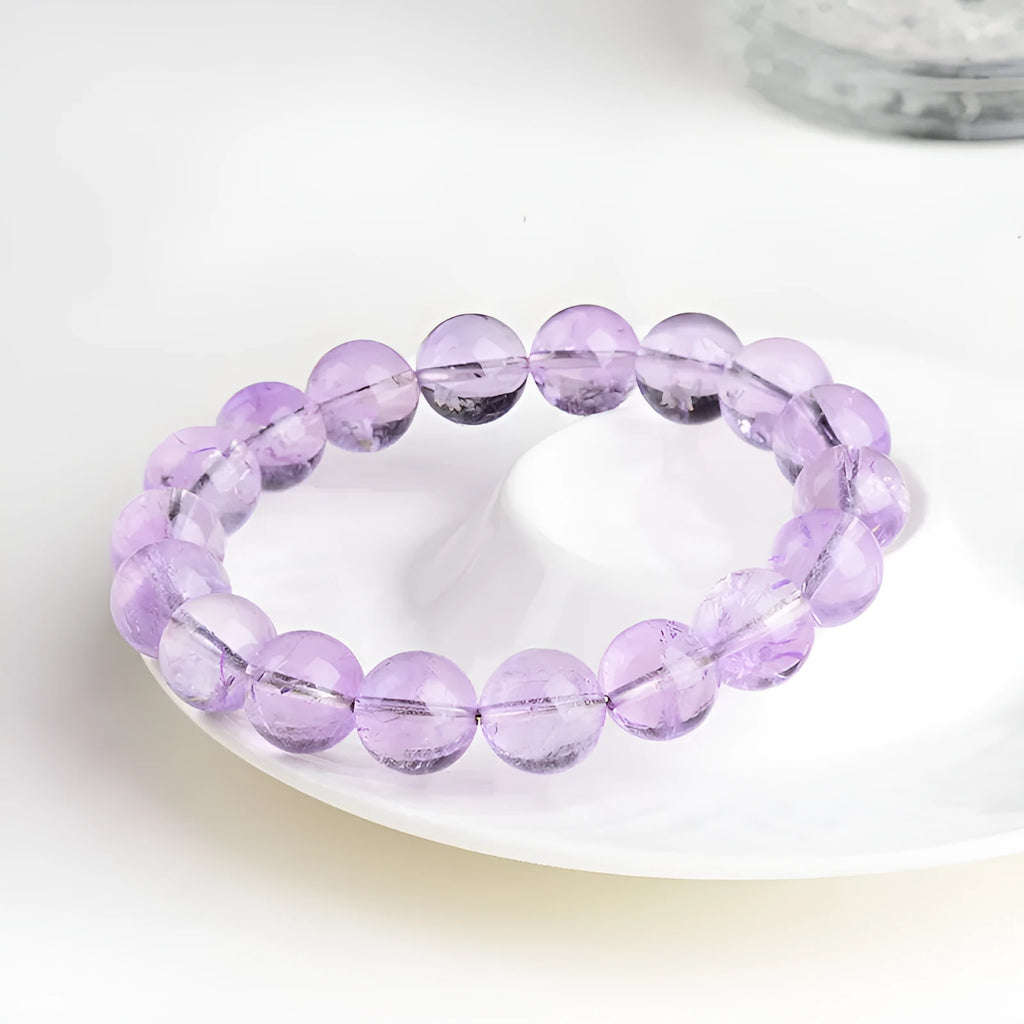 Lavender amethyst crystal bracelet with water ripple design and round beads in light purple colour