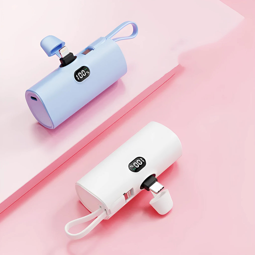 Compact capsule-shaped power bank in various colours showing digital display and built-in plug.