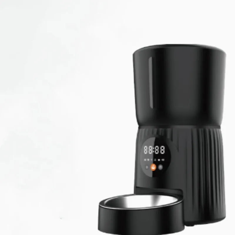 Black and white automatic pet feeder with smartphone app showing feeding schedule