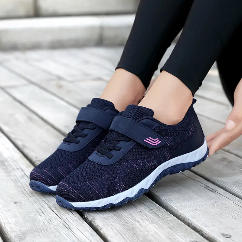 Women's low-top grey purple wedge shoes with Velcro strap and breathable mesh upper.
