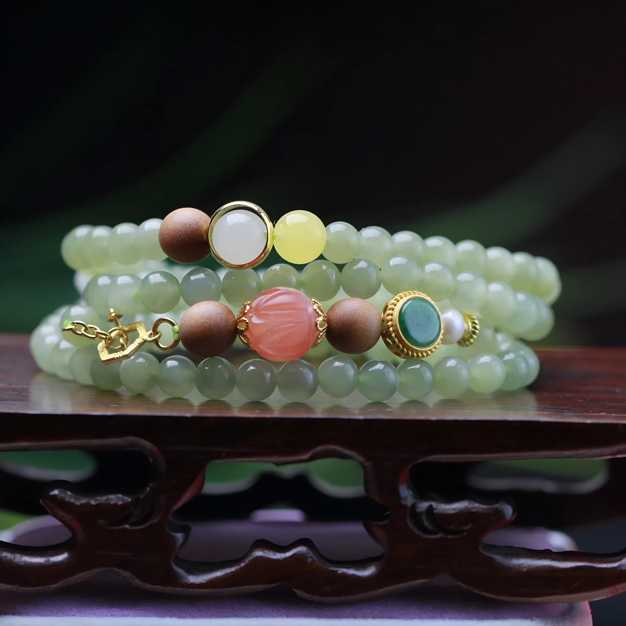Hetian jade necklace with red lotus beads, white sandalwood, and beeswax, featuring a fu charm and zodiac animal design.