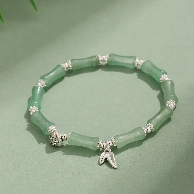 Electroplated bamboo strawberry crystal bracelet for women in green aventurine, showing natural stones on a bracelet.