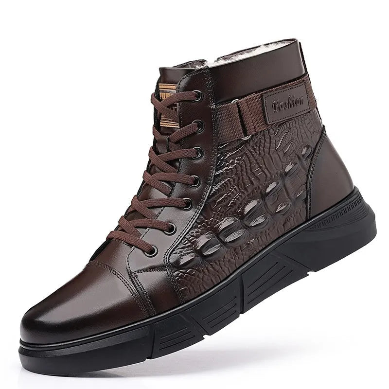 Black genuine leather snow boots with a fur collar, rubber sole, and front laces on a winter background.