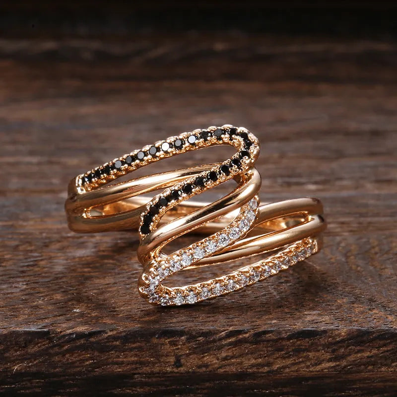 Close-up of a women's copper ring with micro-inlaid zircon stones and a silver-toned electroplated finish.
