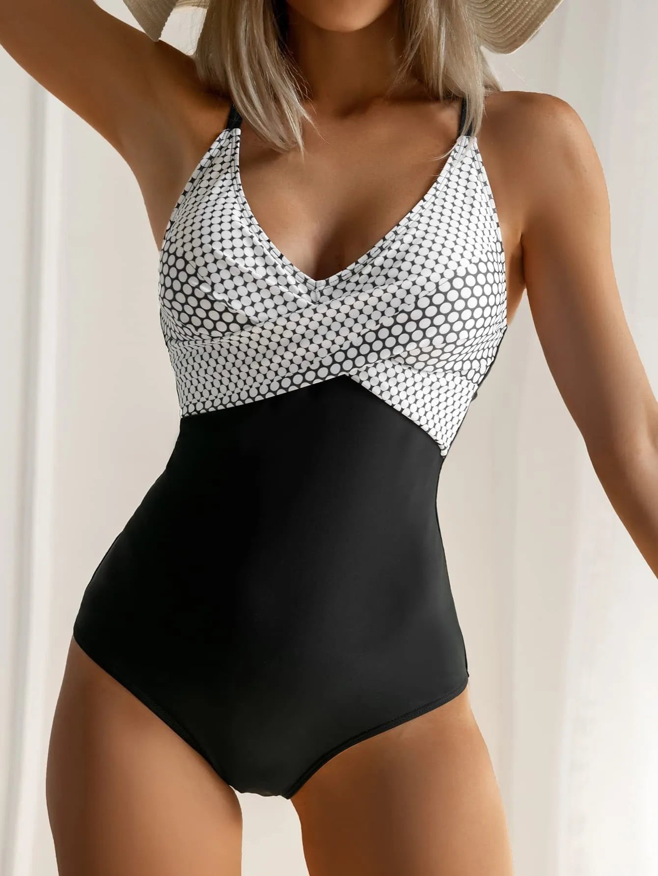 Women's printed one-piece bikini swimsuit with lace-up back in a floral pattern.