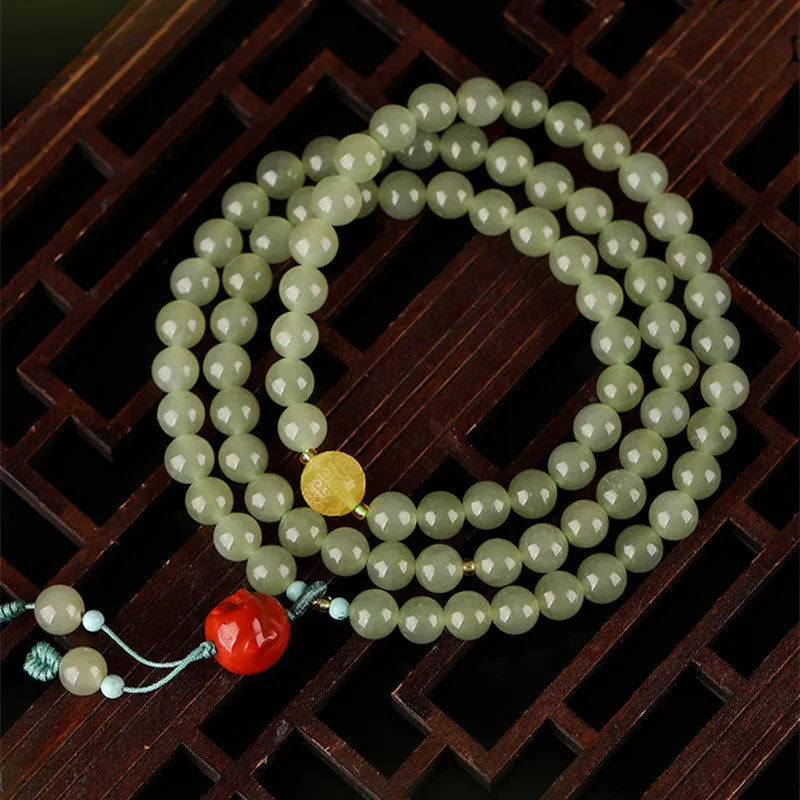 Pale blue hetian jade bracelet with 6mm beads in a three-circle hand-stringed design for women