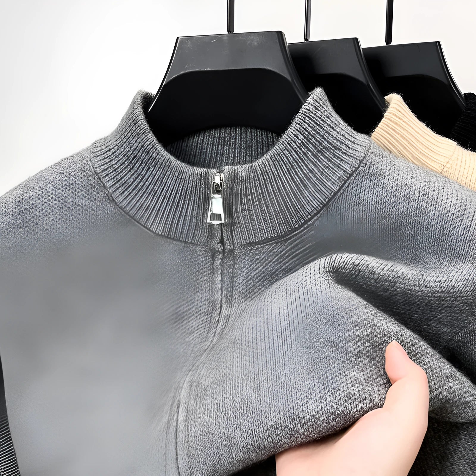 Men's black knitted zipper cardigan with stand collar shown in loose fit