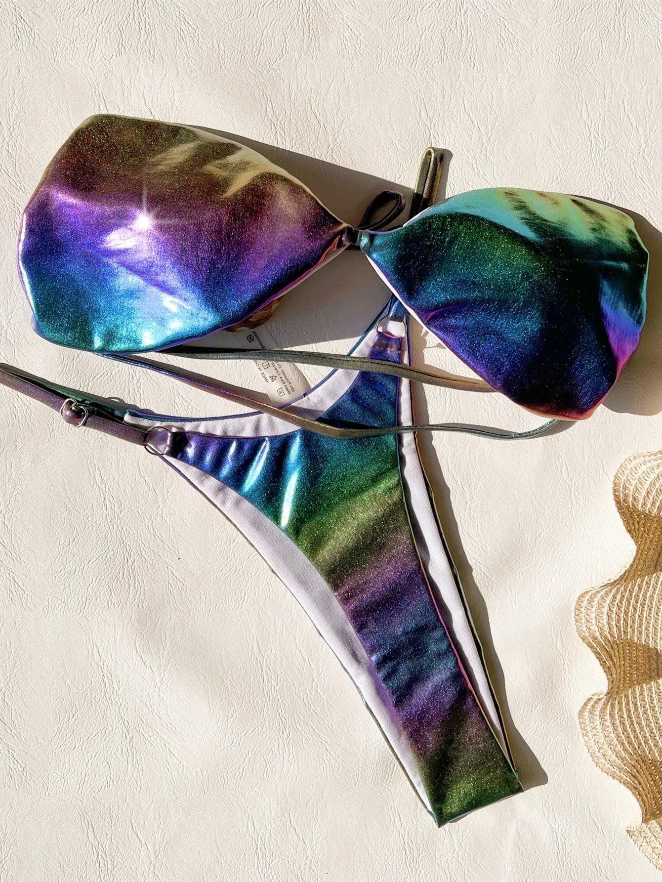 Gradient purple women's bikini swimsuit set on a mannequin.
