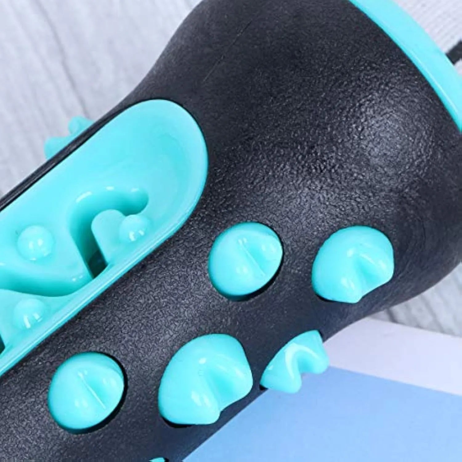 A natural rubber dog toothbrush chew toy in blue, showing its textured surface for dental cleaning.