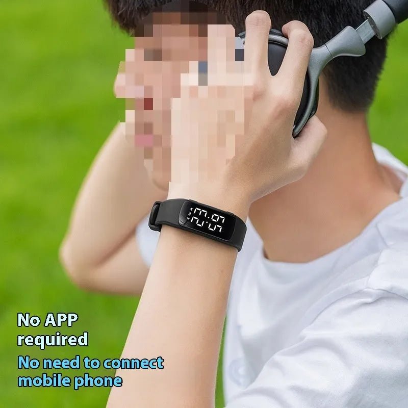 Smart electronic watch with colour options on a silicone strap, showing its LED display and slim profile.