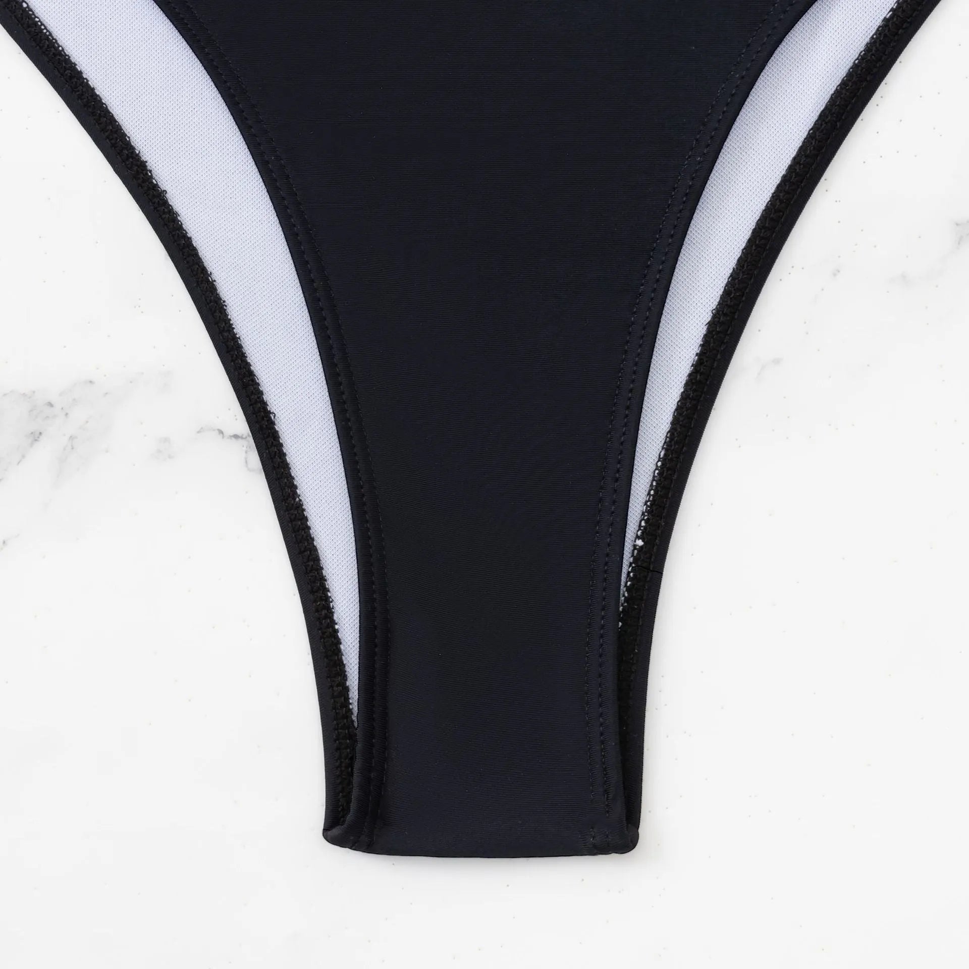 Black women's one-piece swimsuit with contrast stitching and sleeveless hollow design
