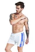 Blue men's lace-up slim-fit sports shorts with built-in padding on a white background.