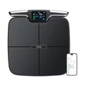 Black eight-electrode body fat intelligent weighing scale on a bathroom floor