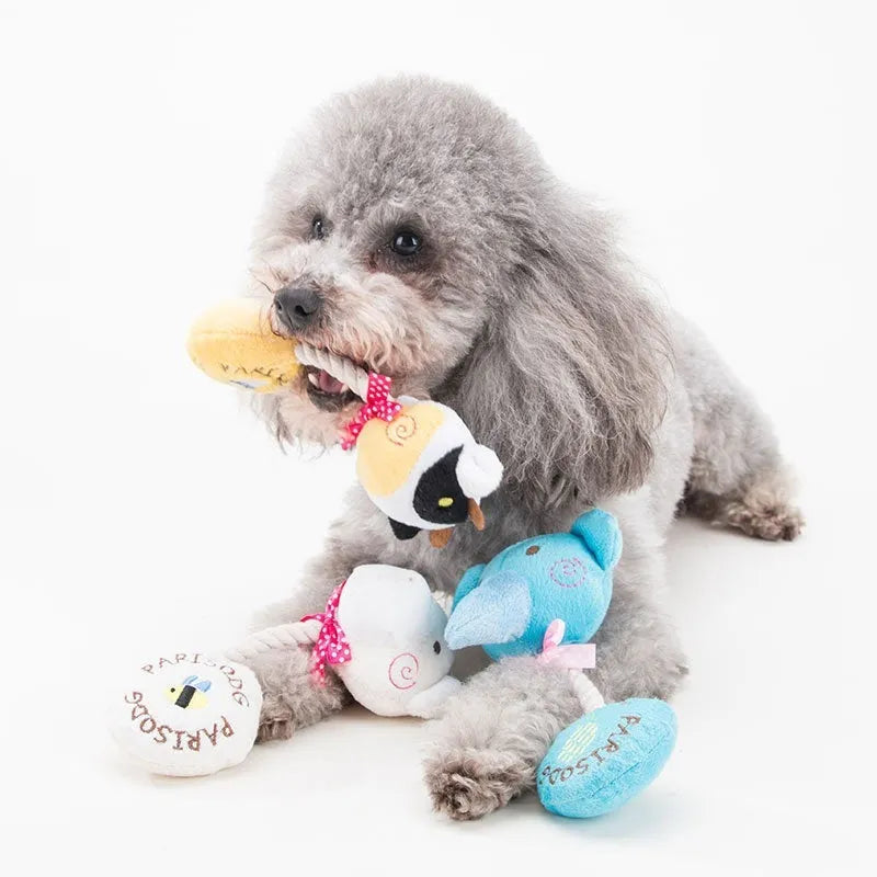 Animal shaped plush dog toy with cotton rope details and squeaker for chewing