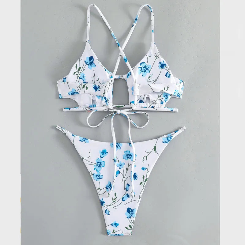 Women's floral print swimsuit set with triangle tie-neck top and matching shorts