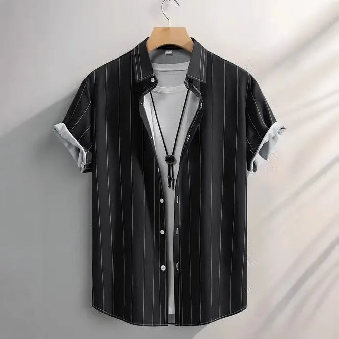 Man wearing a loose-fitting striped short sleeve shirt with a stand collar.