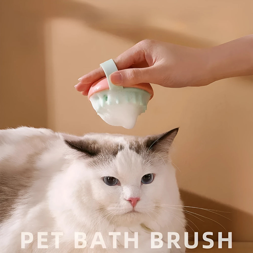 Blue silicone pet bathing brush with soft bristles for massaging and scrubbing cats and dogs.