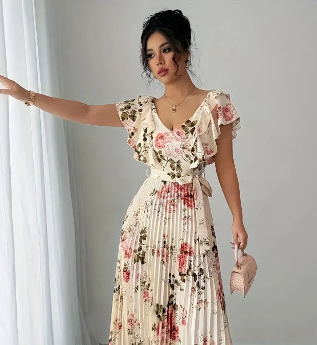 Apricot floral print women's dress with V-neck, ruffled sleeves, and a high-waisted swing skirt.