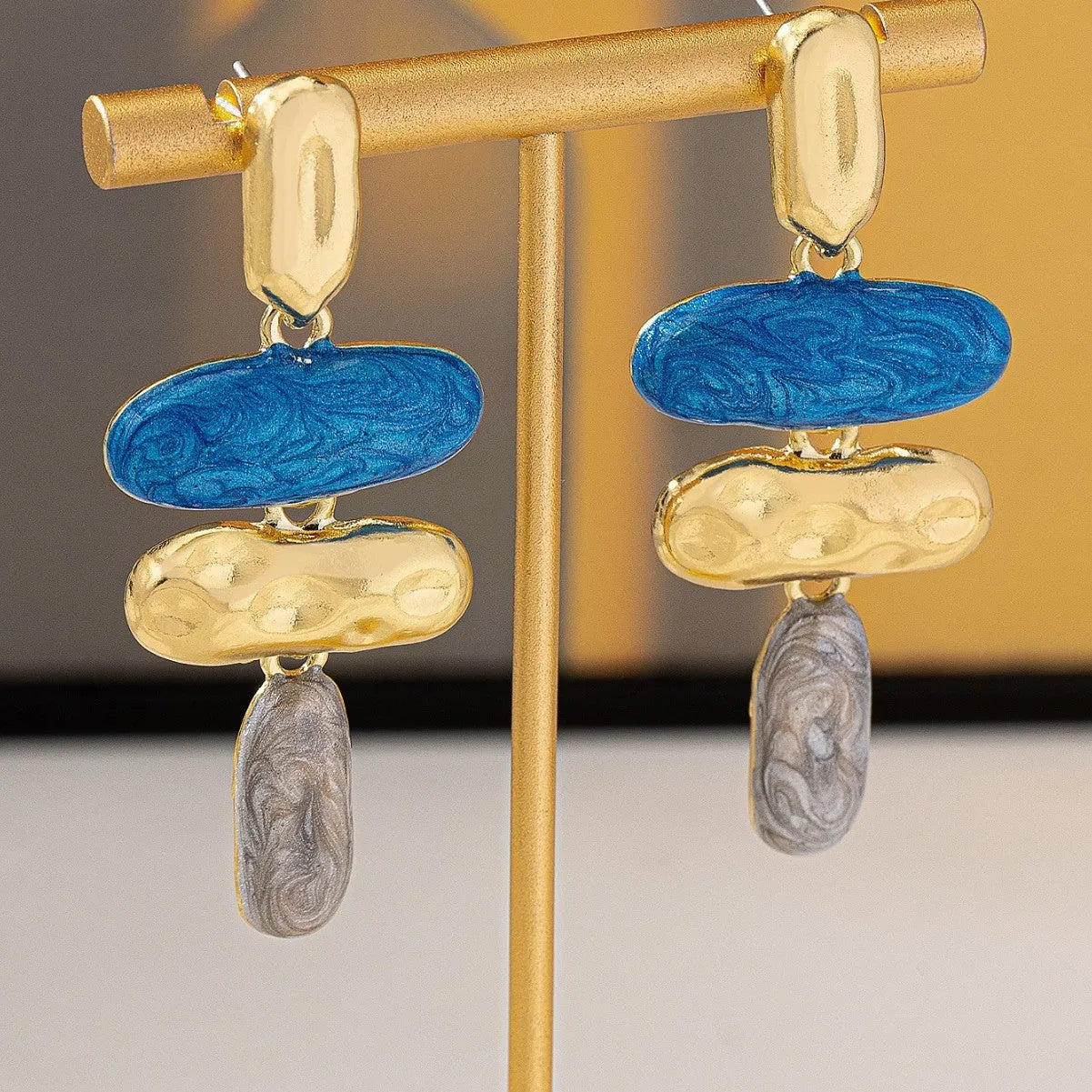 Geometric zinc alloy stud earrings with electroplated multicolour finish and butterfly fastenings
