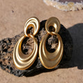 French retro style copper earrings with a U-shaped double circle design in a gold and quicksand finish.