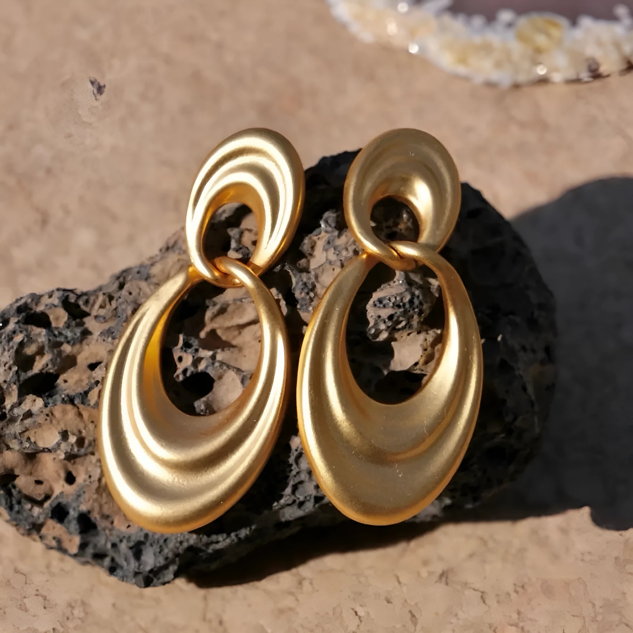 French retro style copper earrings with a U-shaped double circle design in a gold and quicksand finish.
